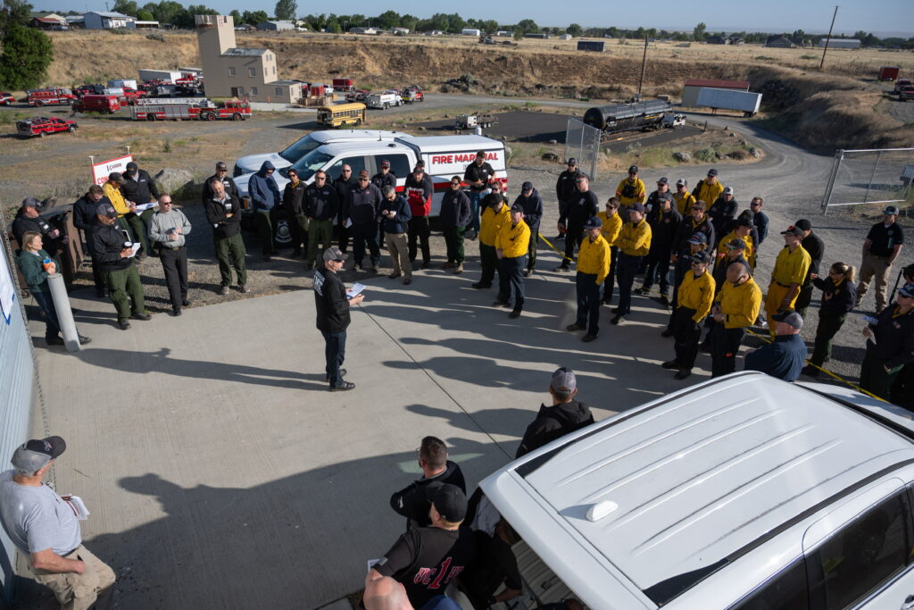 Firefighters being briefed on the Hat Rock fire in Umatilla County, June 14, 2023
