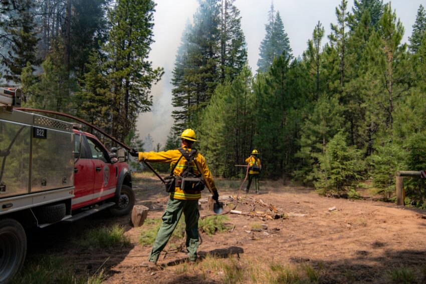 Fire fighters near an engine on the Falls Fire