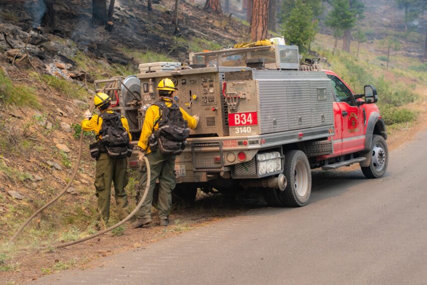 Firefighters working near a fire engine