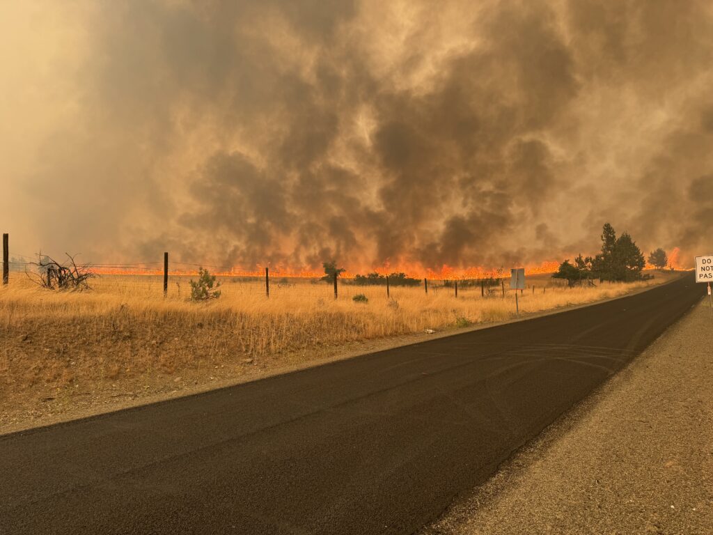 Fire front coming towards homes near the town of Monument