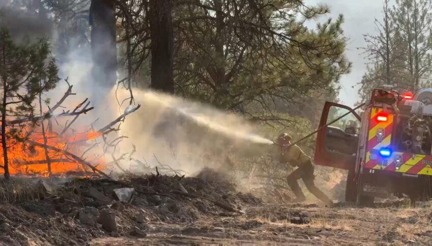 Engine Crew uses their quick reel to knock down flames